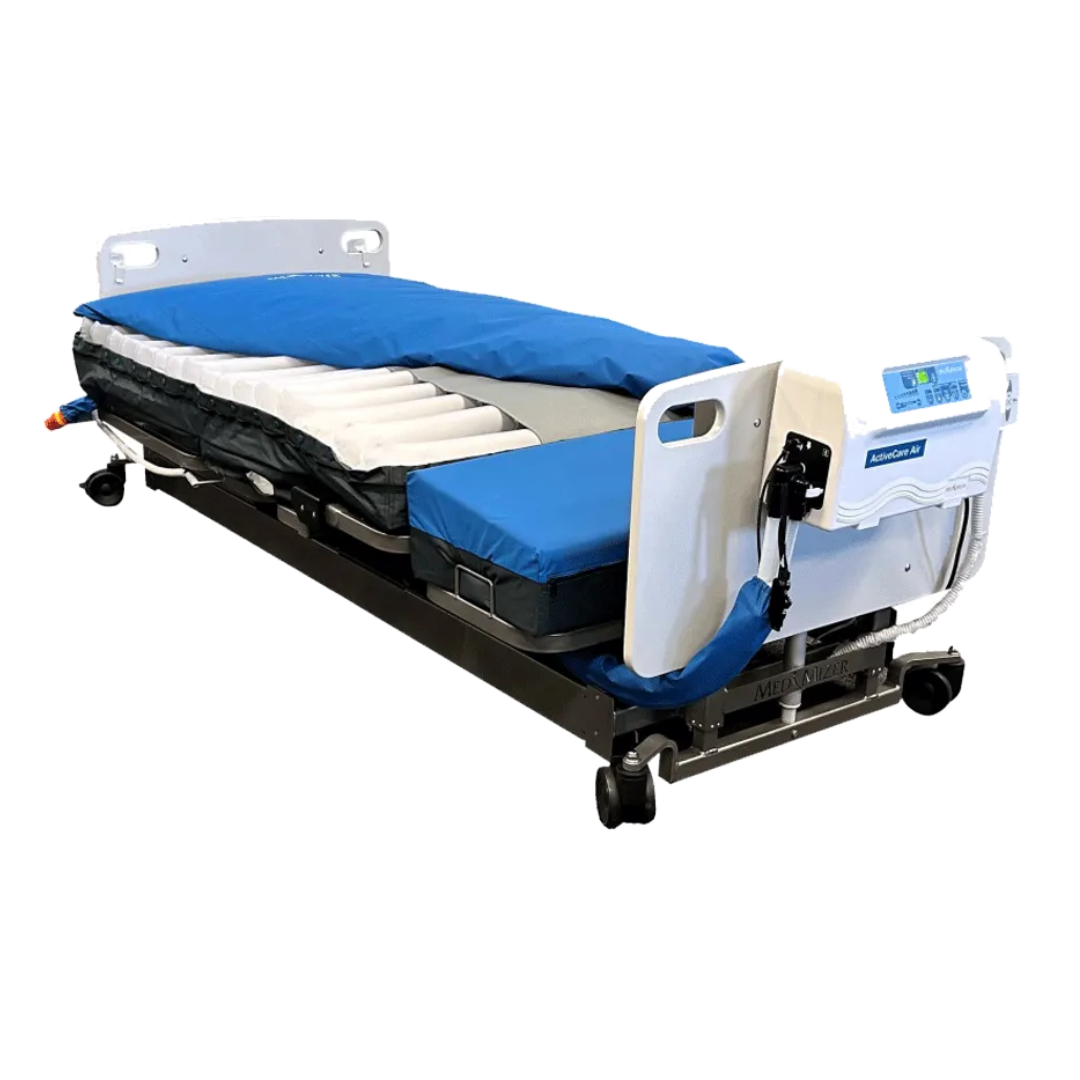 The Med-Mizer ActiveCare Alternating Pressure Air Mattress, in blue, is placed on a hospital bed frame with head and foot control panels, providing patient comfort and optimal pressure relief.